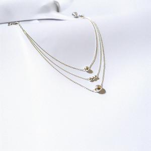 Collar triple bolitas de plata