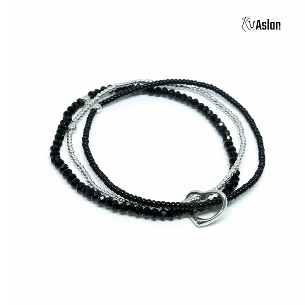 Pulsera triple con corazón