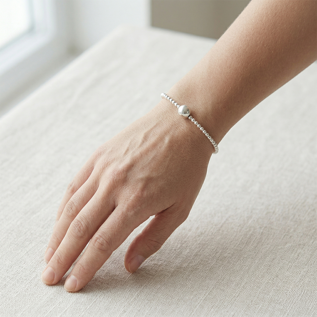 Pulsera bola de plata
