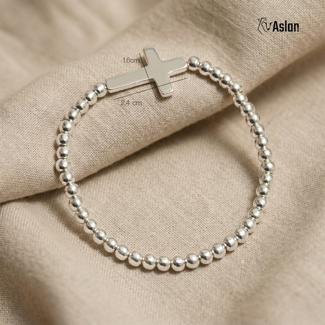 Pulsera cruz de plata tambor