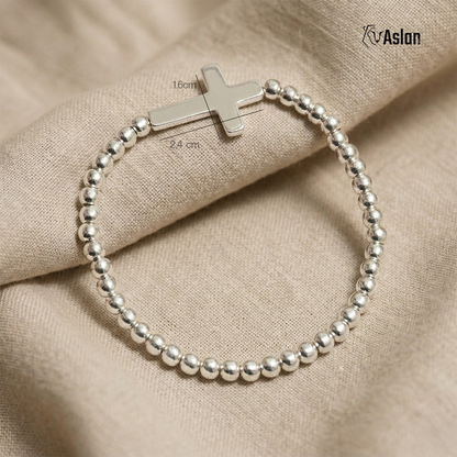 Pulsera cruz de plata tambor
