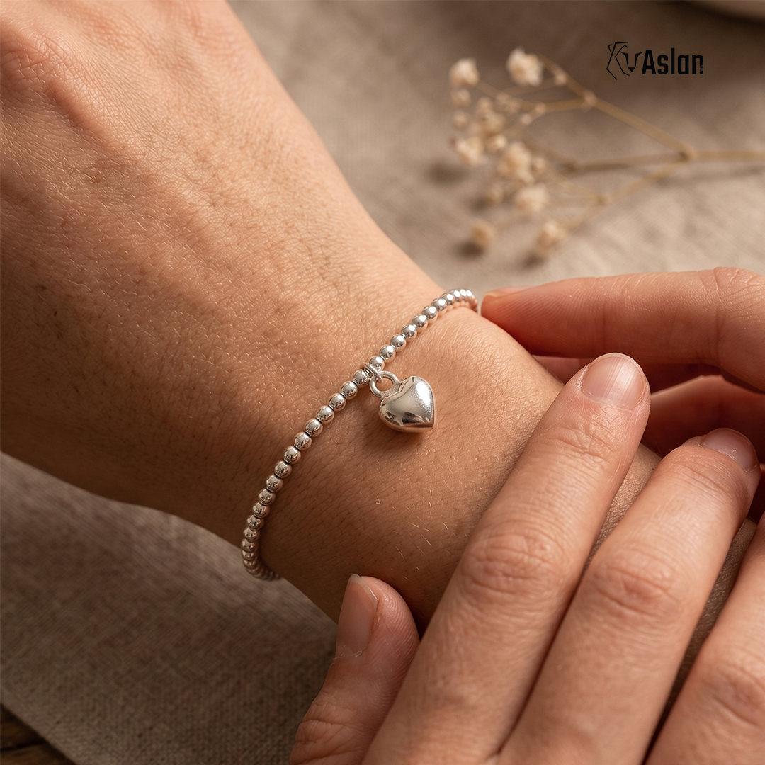 Pulsera corazón claro