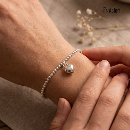 Pulsera corazón claro