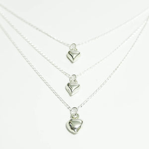 Collar triple corazón bombeada