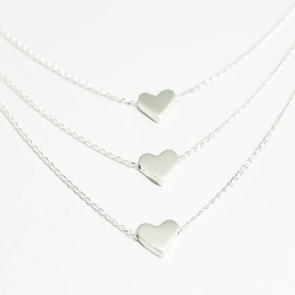 Collar triple corazón plano