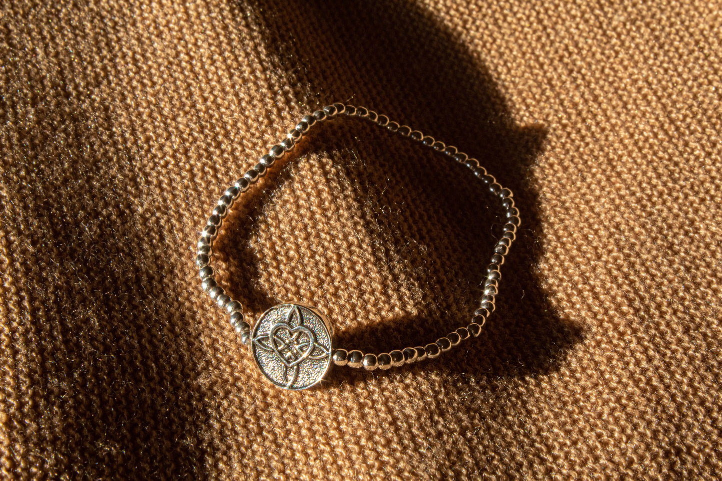 Pulsera medalla nudo de bruja